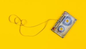gray cassette tape on yellow surface
